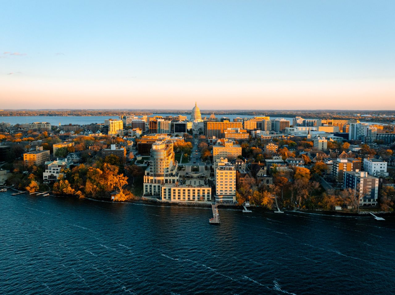 Long shadows and warm glow of Madison from Lake Mendota side