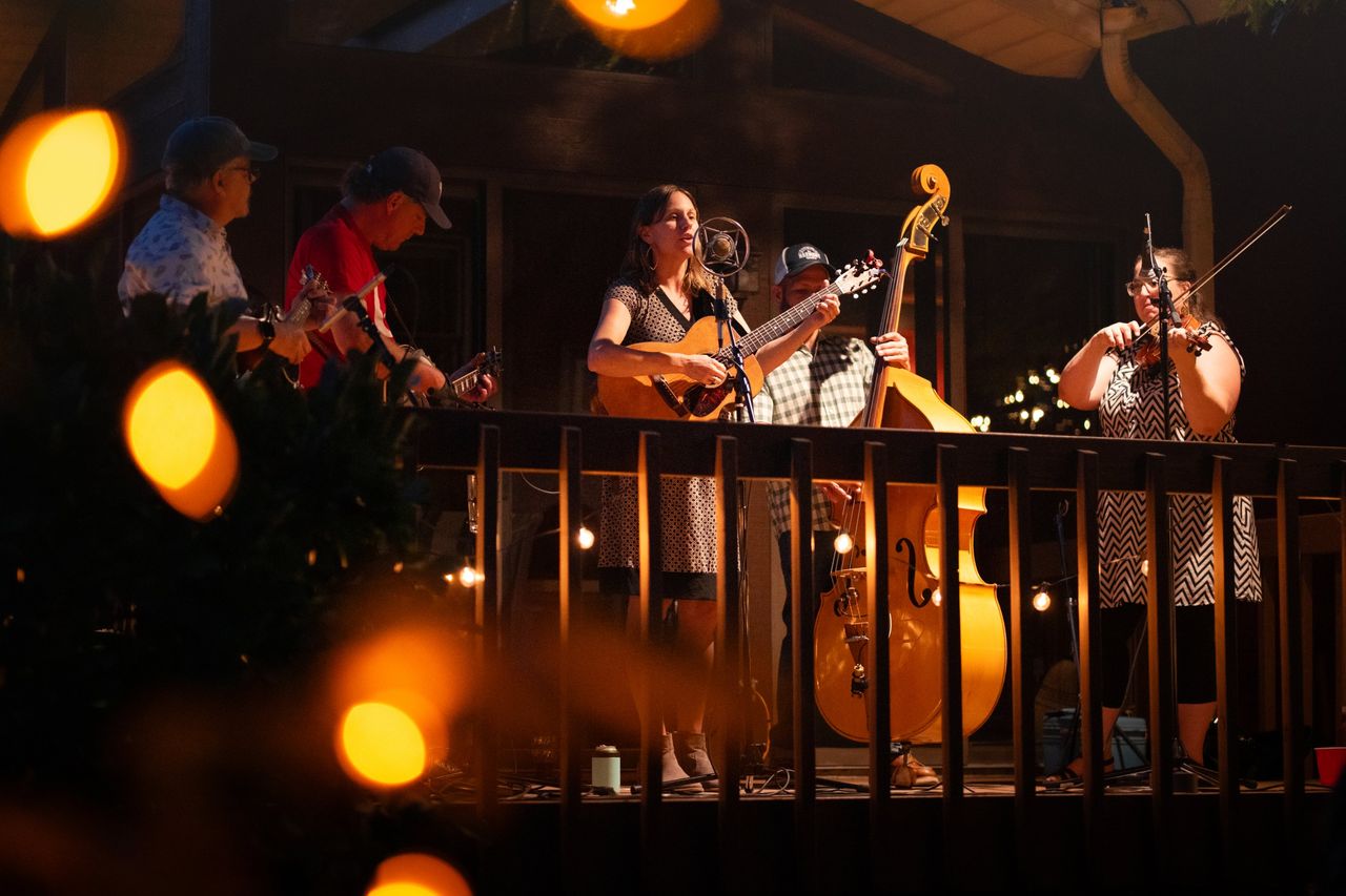 A bluegrass music set on a porch